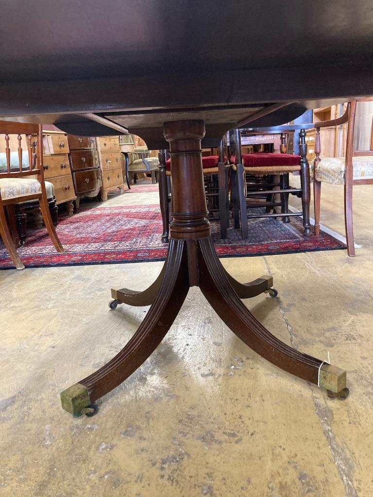 A George III style rosewood banded mahogany oval breakfast table, length 170cm, width 120cm, height 73cm